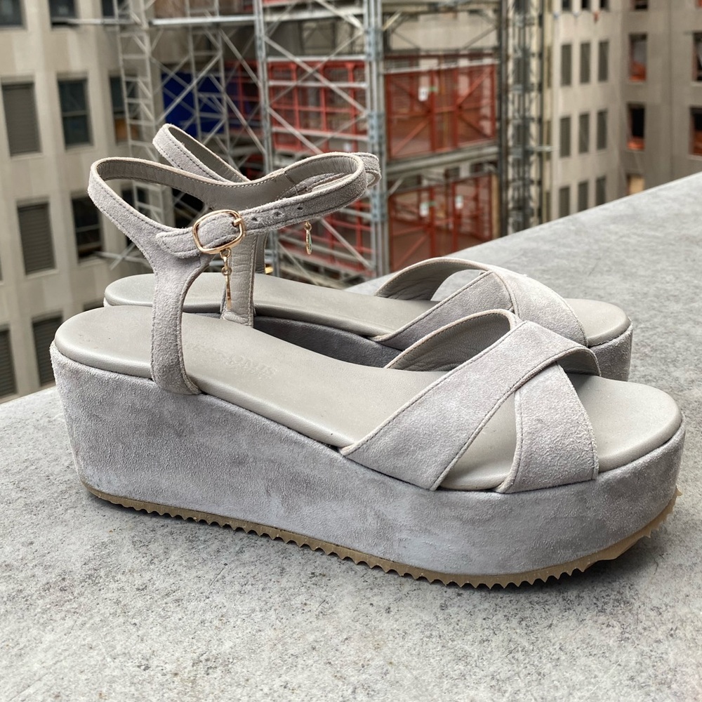 Suede wedges with evil eye charm at buckle